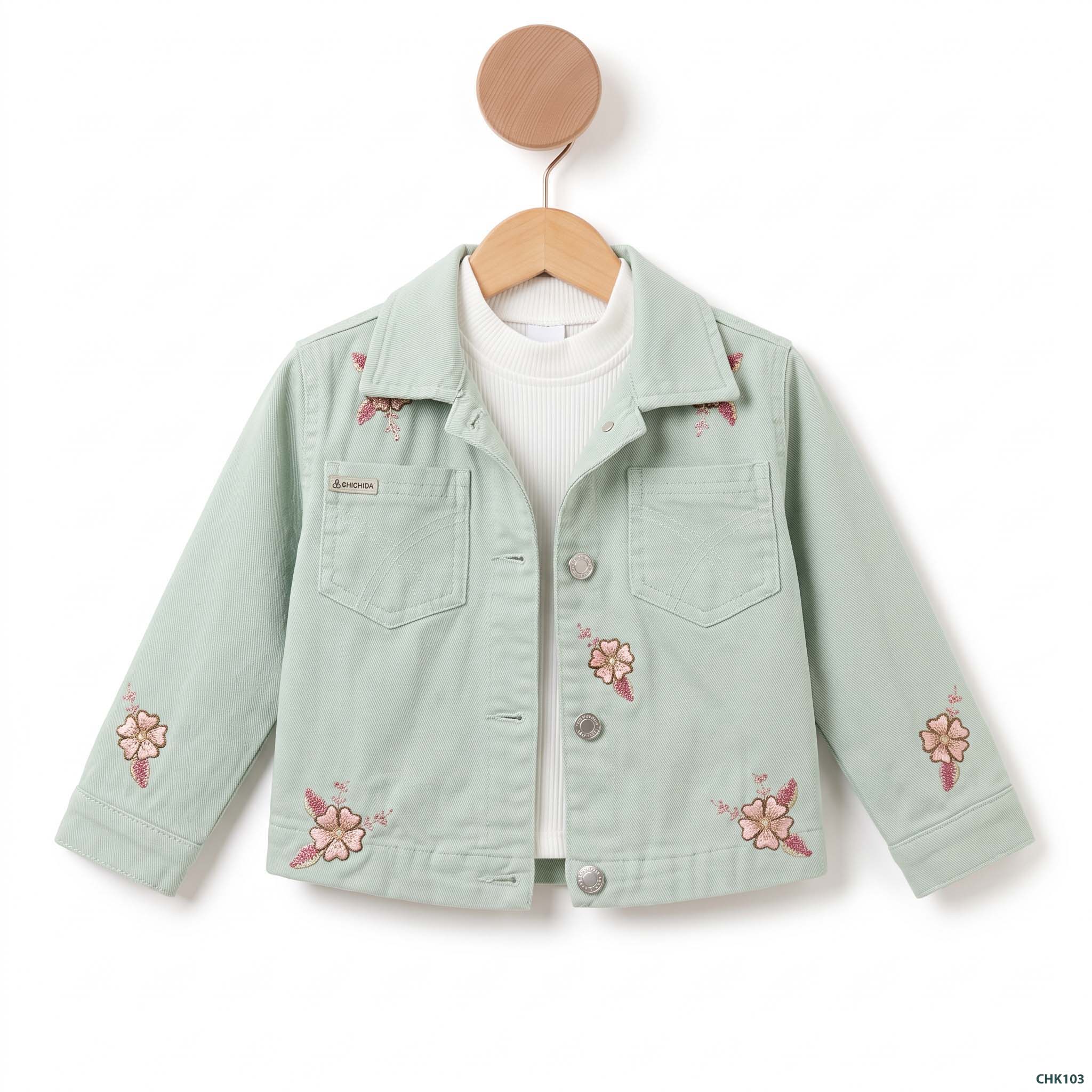 Green_twinset_hanging_on_hanger_2K_20261001214121